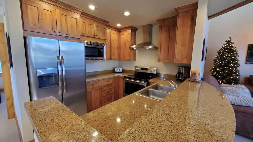 Kitchen has granite & stainless