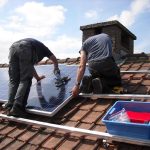 Solar being installed on a roof