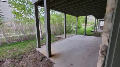 Concrete patio behind townhome