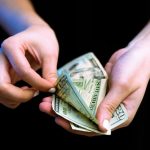 Paying money in a photo Igal Ness on Unsplash