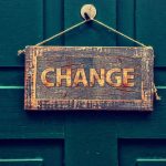 Change sign hanging on the door of a home